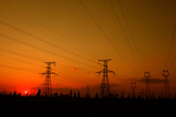 Fototapeta premium electric tower in the setting sun