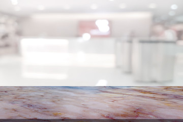 Marble table with register counter blurry background
