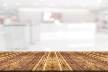 Empty wooden board space platform with register counter blurry background