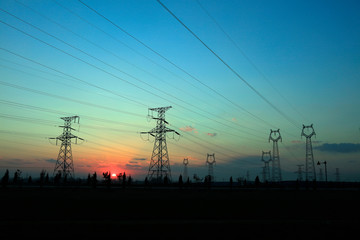 electric tower in the setting sun