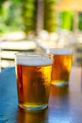 Cold amber color light spanish beer served in glass in outdoor cafe in sunny Andalusia, Spain
