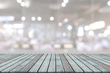 Wooden table with blur restaurant background