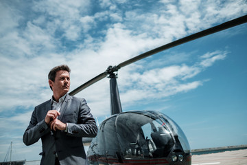 Businessman standing near private helicopter © Nejron Photo
