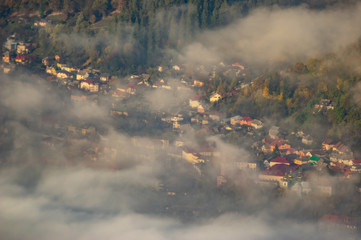 Morning fog in autumn mountains