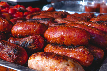 BBQ with fiery sausages on the grill food court, mouth-watering snack