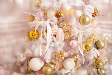Decorated Christmas tree close-up, Christmas balls and garlands. Winter holidays.