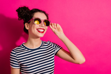 Close-up portrait of her she nice attractive lovely lovable dreamy cheerful cheery girl touching specs anticipating holiday isolated over bright vivid shine vibrant pink fuchsia color background