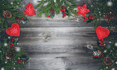 christmas background with decorations and snow on wooden board