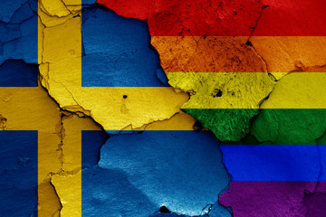 flags of Sweden and LGBT painted on cracked wall