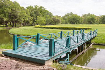 Fototapeta premium Green Wooden Bridge in Garden