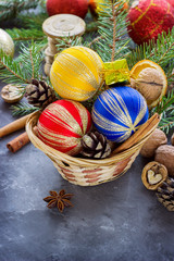 Basket full of Christmas attributes and present boxes on a dark background. Christmas composition
