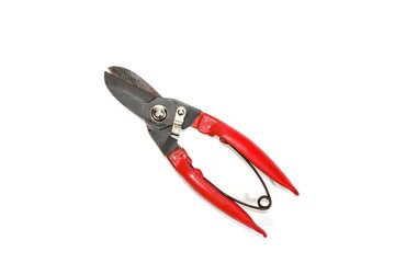 red garden scissors on white isolated background