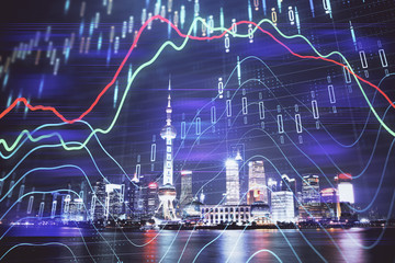 Financial graph on night city scape with tall buildings background multi exposure. Analysis concept.