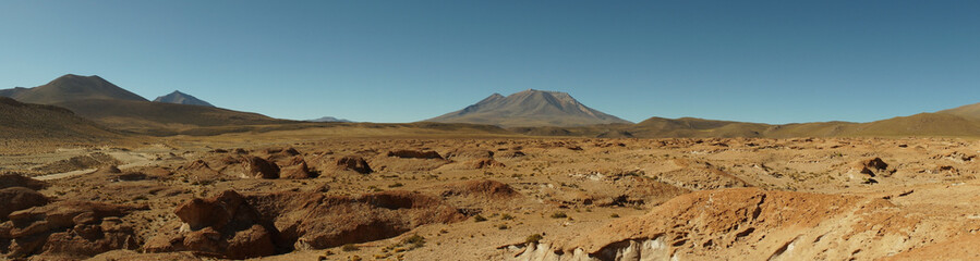 Dry mountain landscapes near Árbol de Piedra rock in the Eduardo Avaroa Andean Fauna National Reserve near Salar de Uyuni salt flats in Bolivia.