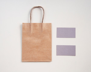 Craft paper shopping bag with business card. Mockup for design, logo, brang identity.