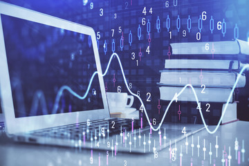 Stock market chart hologram drawn on personal computer background. Double exposure. Concept of investment.