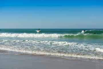 Fototapeta na wymiar Sea waves in sunny day. Santa Maria del Mar beach in Cadiz , Andalusia, Spain