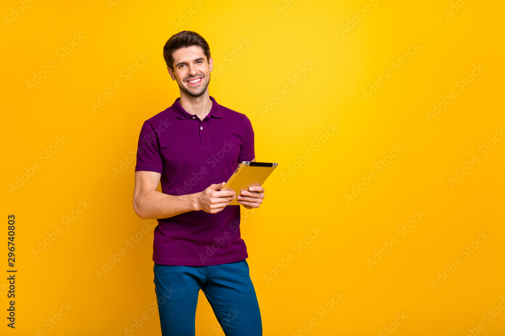 Poster portrait of his he nice attractive cheerful cheery content guy using digital ebook app browsing web 