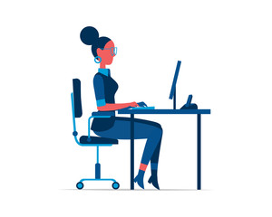 An employee works at the office desk