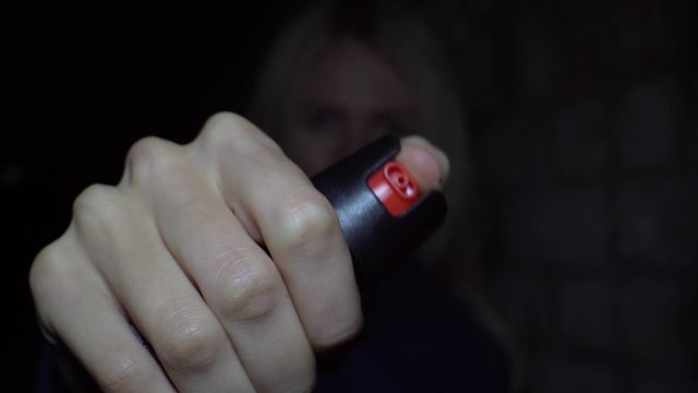 A woman in a dark alley waved pepper scaring off a robber,