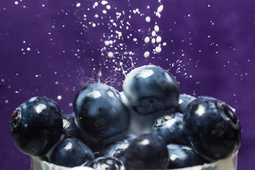 blueberryries being poured over with milk 