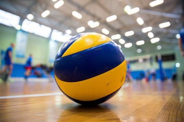 Volleyball ball on the floor - obrazy, fototapety, plakaty