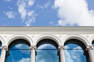 The cloud reflected in the window glass of the building. Modern Building Architecture with blue sky...