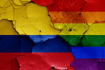 flags of Colombia and LGBT painted on cracked wall