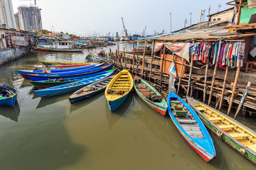 Beautiful view of generic homes at the waterfront in the old Sunda Kelapa harbor area in Jakarta, Indonesia - 296742864