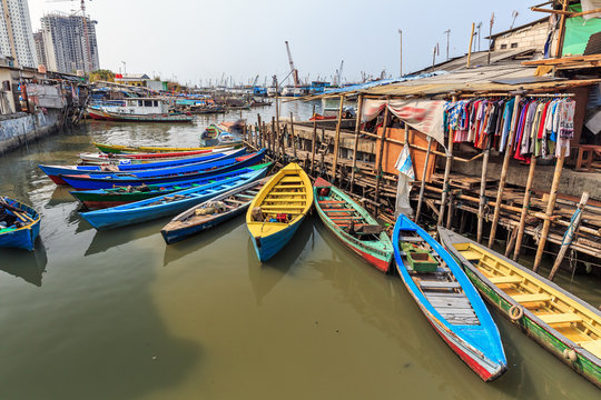 Beautiful view of generic homes at the waterfront in the old Sunda Kelapa harbor area in Jakarta, Indonesia
