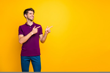 Portrait of his he nice attractive content cheerful cheery glad guy wearing lilac shirt pointing...