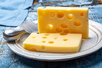 Two blocks of French emmental semi-hard cheese
