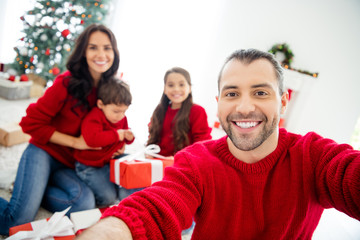 Self-portrait of nice attractive lovely idyllic careful adorable cheerful cheery dreamy affectionate perfect family celebrating newyear eve noel tradition light white interior living-room