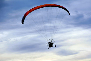 a Moto paraglider in the air