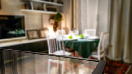 Glass coffee table and free space for your decoration. blurred home interior 