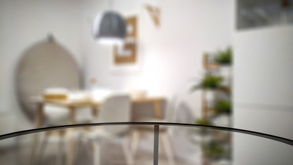 Glass coffee table and free space for your decoration. blurred home interior 