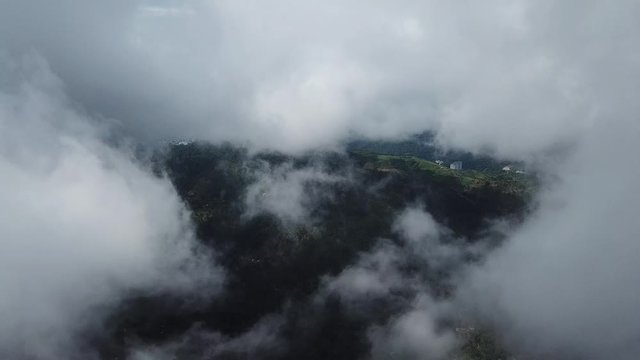 Aerial misty landscape at tropical rainforest at (Bukit Bendera) Penang Hill, Pulau Pinang.
