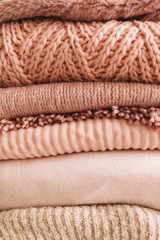 Fototapeta na wymiar Stack of knitted sweaters