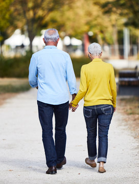 Senior Couple Walking Outdoors Park Talking Love Happy