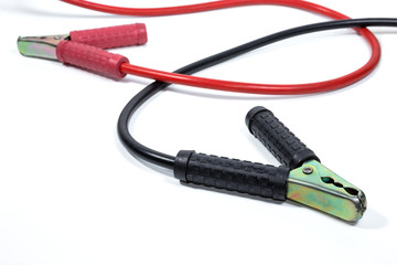 red and black jumper cables on white background