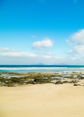 Fototapeta na wymiar Beach and Atlantic Ocean in Caleta de Famara, Lanzarote Canary Islands.