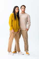 attractive girl standing near man with hand in pocket isolated on white