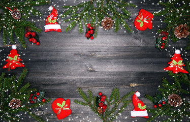 christmas background with decorations and snow on wooden board