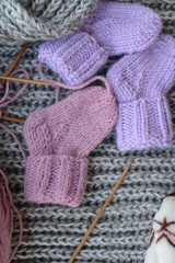 Pink and purple baby socks, made of warm and soft woolen yarn