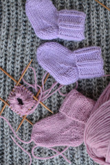 Pink and purple baby socks, made of warm and soft woolen yarn