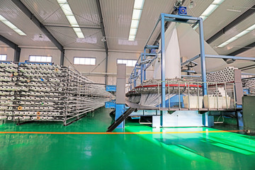 plastic weaving workshop circular knitting production line, China.