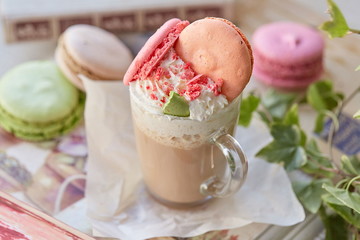 Cocoa with whipped cream and macaron