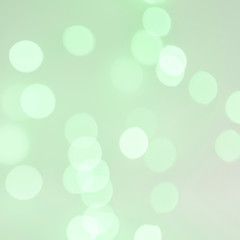Bokeh lights on green background
