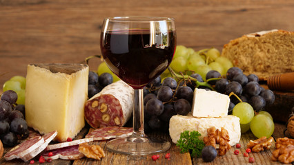 red wine with salami, grape and cheese