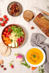 vegan food assortment, banana bread, soup and buddha bowl